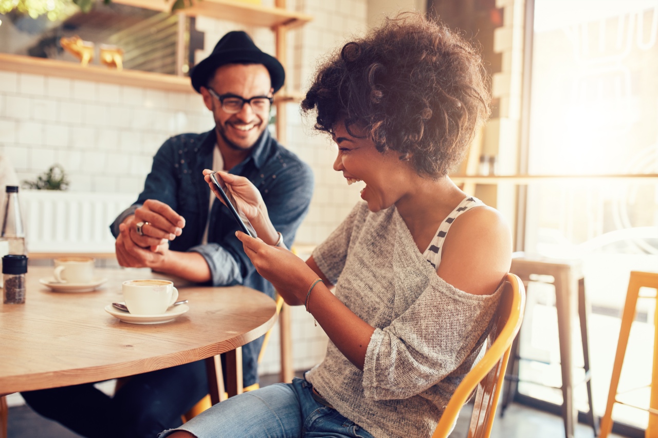 friends enjoying coffee while laughing