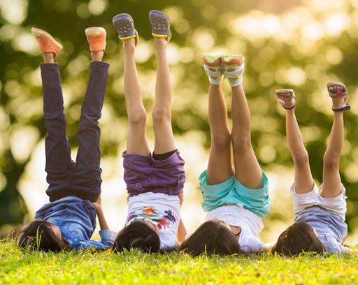 Happy kids playing in the grass